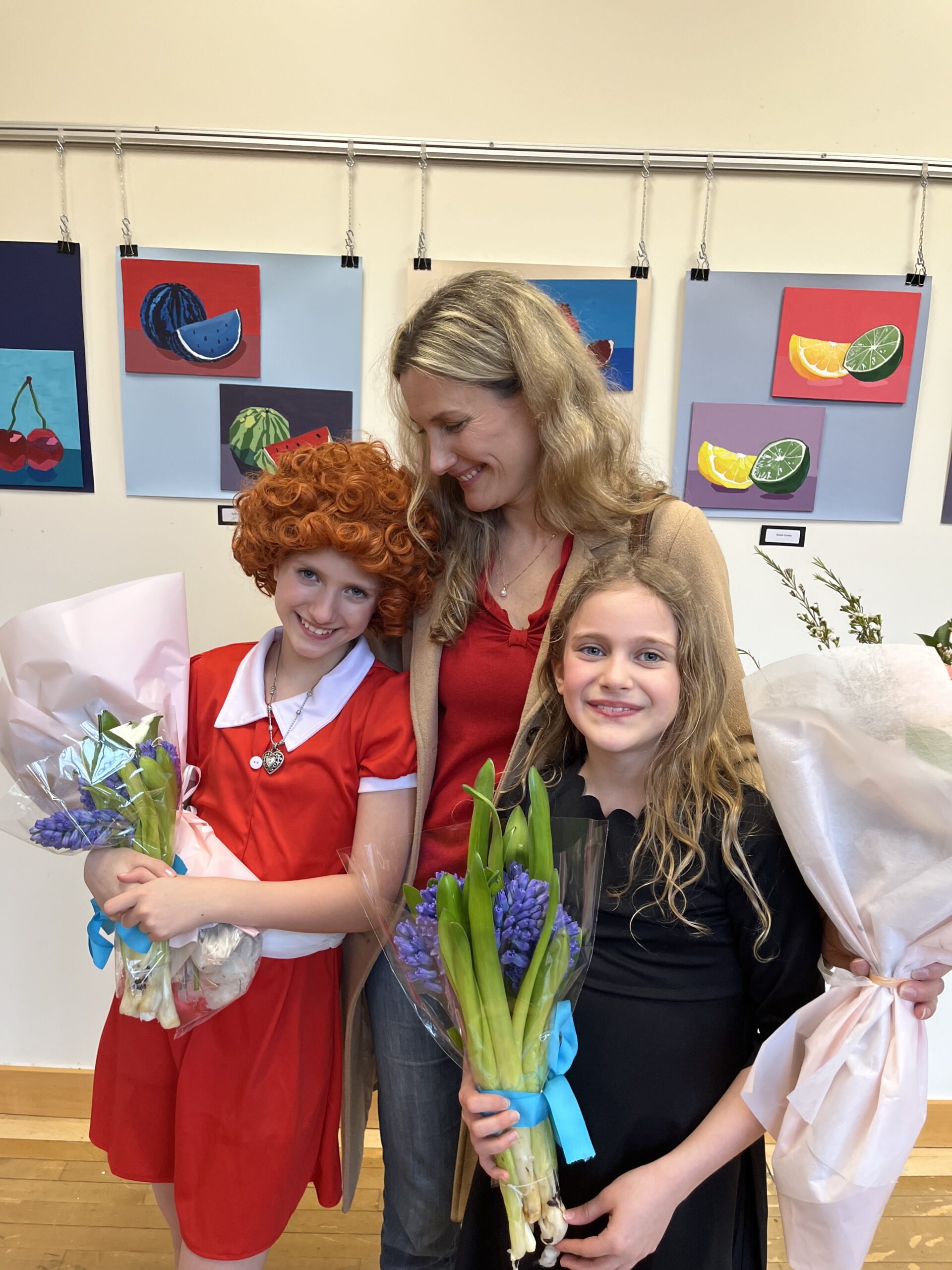 Meredith Ashton Beales with daughters at the Junior School’s production of ‘Annie’